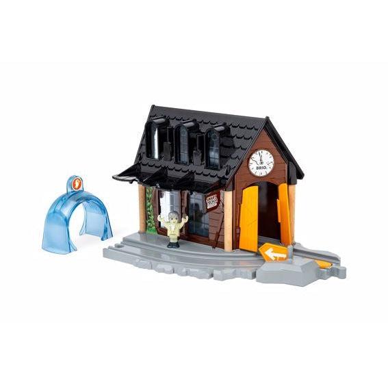 Image of the play set outside of the packaging. It is a haunted looking train station with a ghost arch.