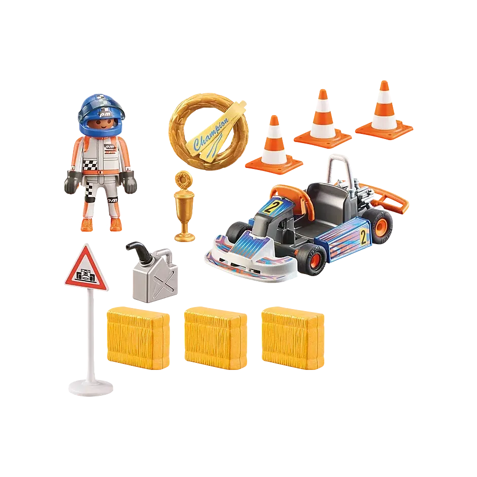 This image shows some of the pieces in the box, the go kart, driver, cones, trophies, gas, signs and hay obstacles. 