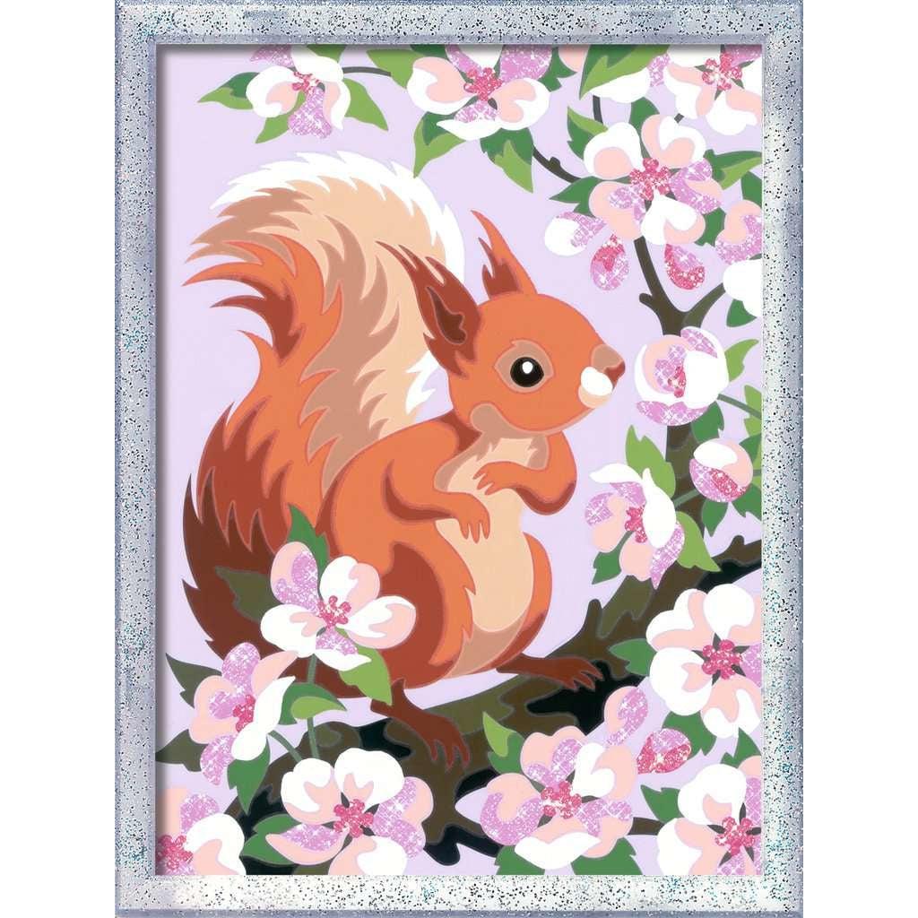 a close up look on the completed painting of the squirrel, ther are different shades to bring the bushy rail to life on the orange squirrel with a light pink background. the tree is blossoming lovely flowers in the springtime. 