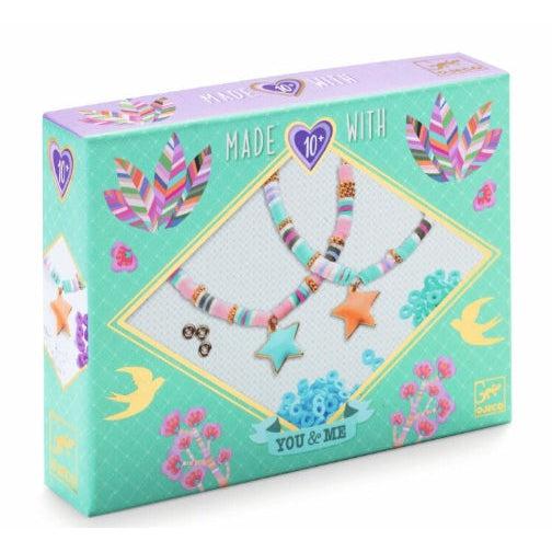 Image of the packaging for the Star Heishi Beads & Jewelry craft kit. On the front is a picture of what the finished product could look like.