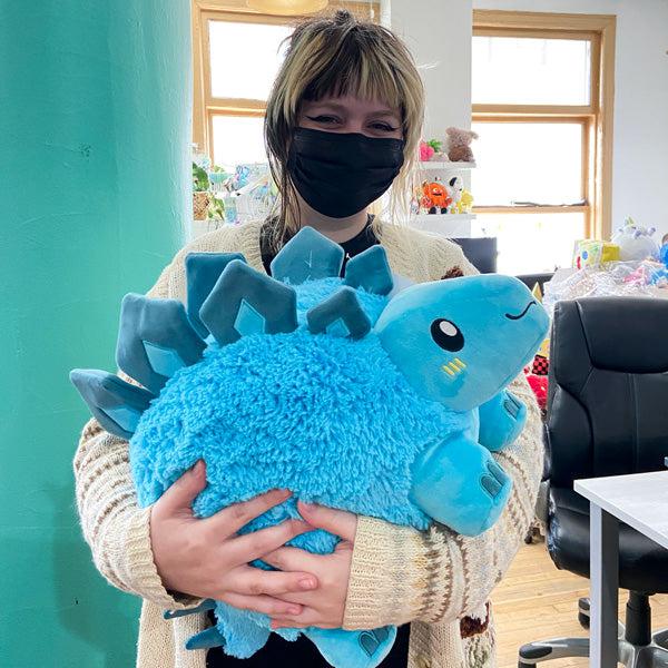 person holding a plush