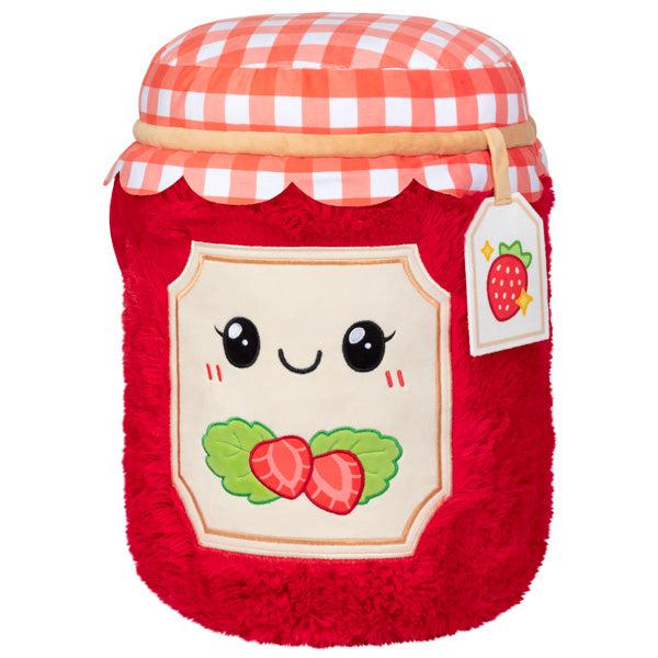 Image of the Strawberry Jam squishable. It is a red jam jar with strawberry labels and a red checkered rag on top of the jar.