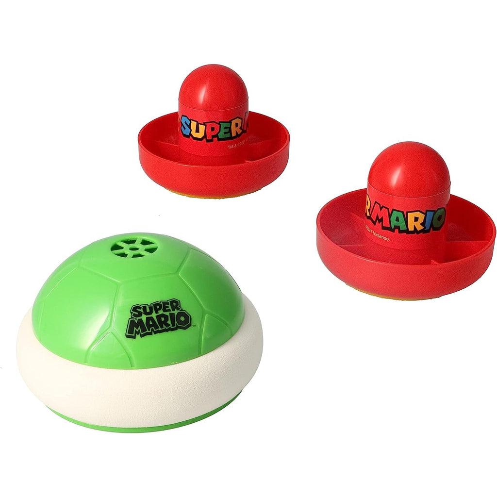 Image of the toy outside of the packaging. It includes two red plastic mallets with the "Super Mario" logo on it and a green koopa troopa shell with a white bumbing protective ring around the bottom.