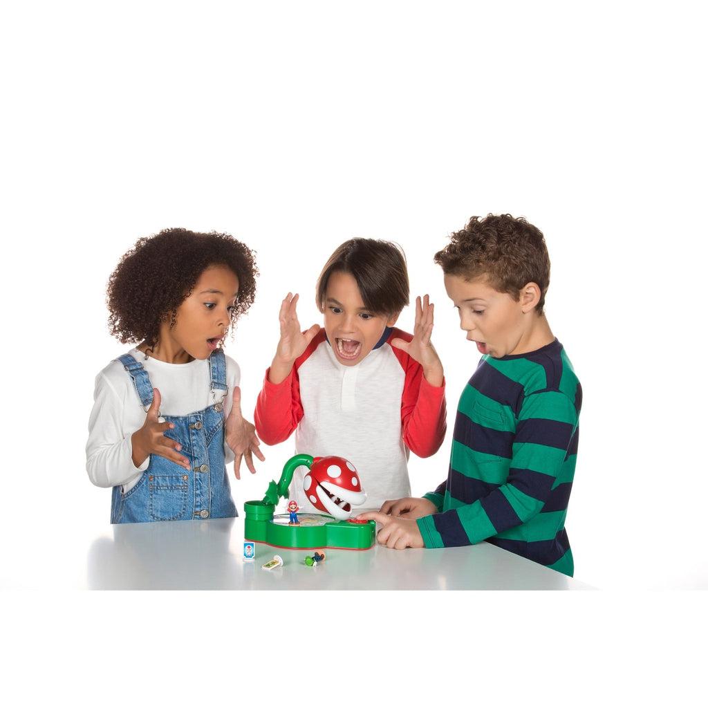 Three children playing with the Pihrana Plant game