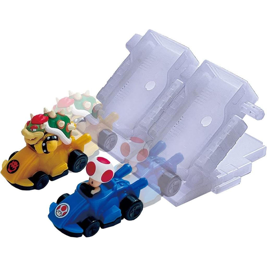 Image of the Super Mario Racing Deluxe Expansion Pack. It comes with a Bowser racing car and a Toad racing car as well as two docks that can be lifted up for the start of a race.