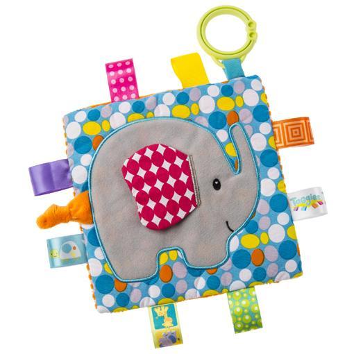Image of the Taggies Crinkle Me Elephant. On the front is an embroidered elephant with a pink patterned ear that sticks out. On the edges are ribbon tags made from fabrics that fit the color theme.