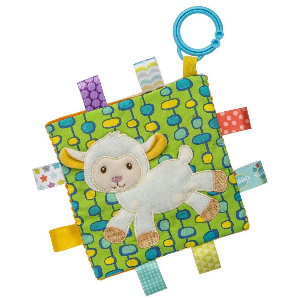 Image of the Taggies Crinkle Me Sherbet Lamb. On the front is an embroidered lamb with a vibrant green, blue, and yellow patterned background.. On the edges are ribbon tags made from fabrics that fit the color theme.