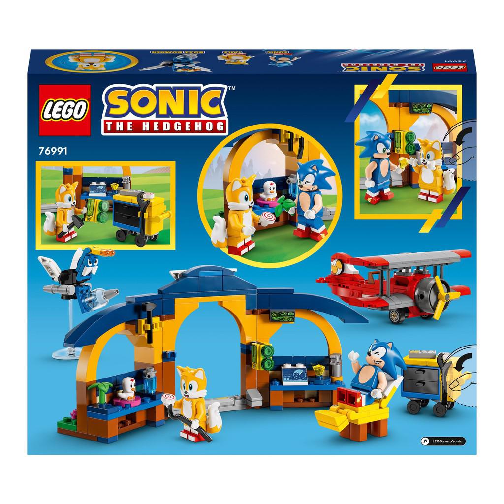this immage shwos the back of the box for the LEGO sonic set. images shows tails in his workshow with a bird, with his cart, and holding a crowbar