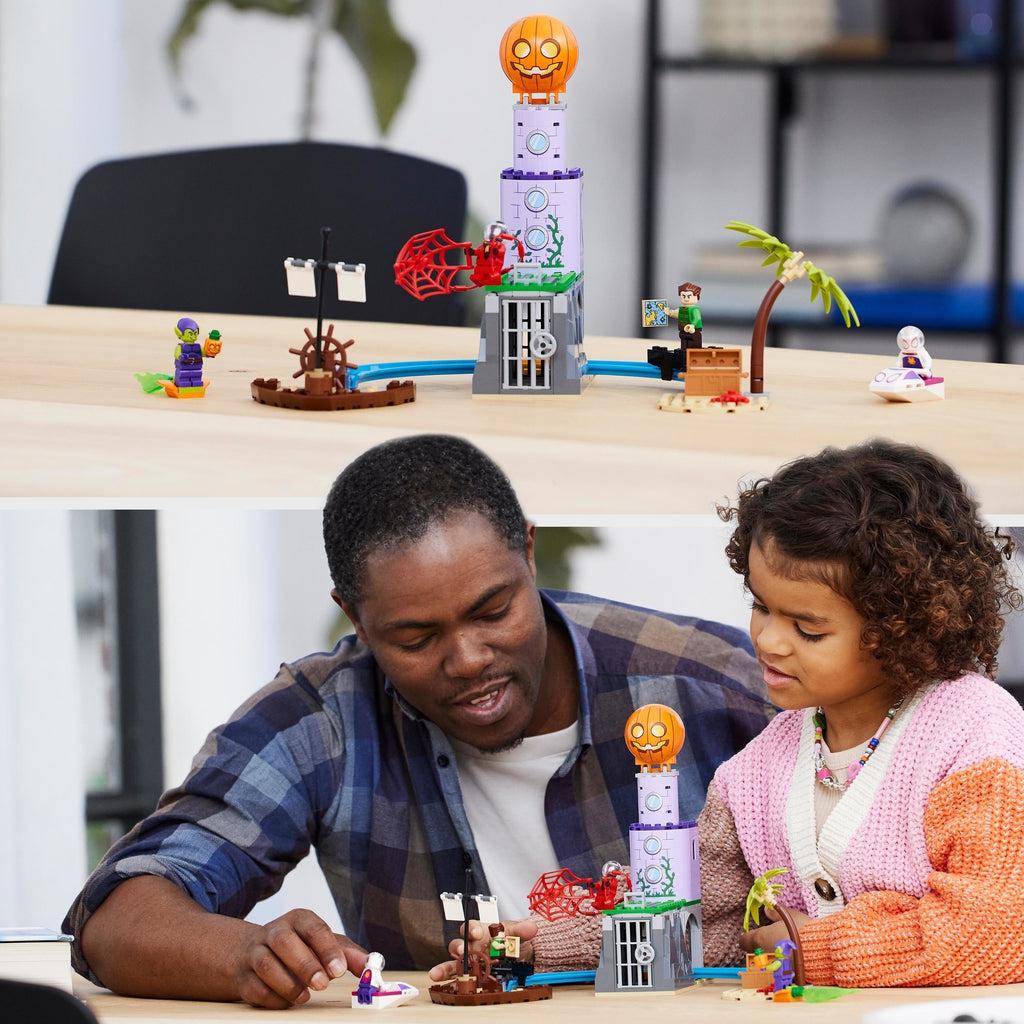 the lego set displayed on a wooden table is shown above an image of a child and their father playing with the set