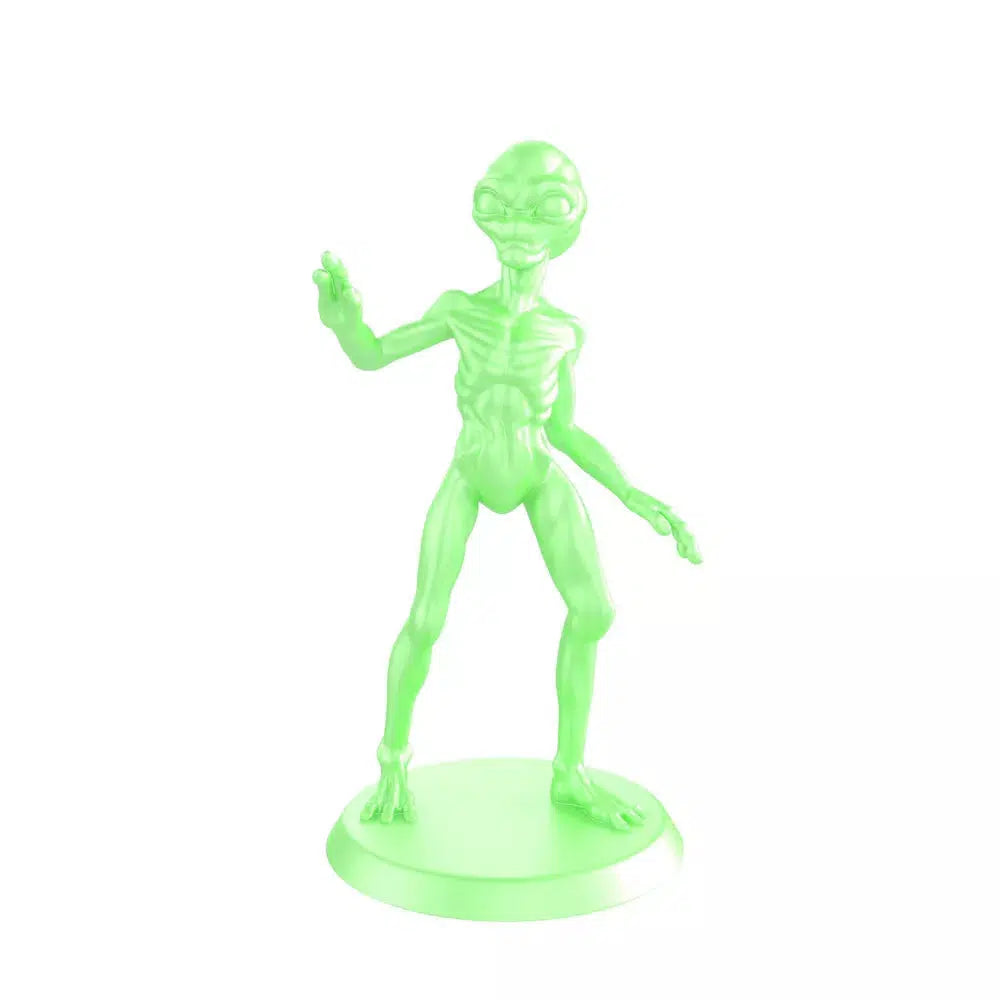 Close up of the alien figure. It is bright neon green and it has an incredible amount of detail. The alien is very skinny (so much so that you can see its ribs sticking out), he has three fingers on each appendage, and his head is bulbous with large eyes.