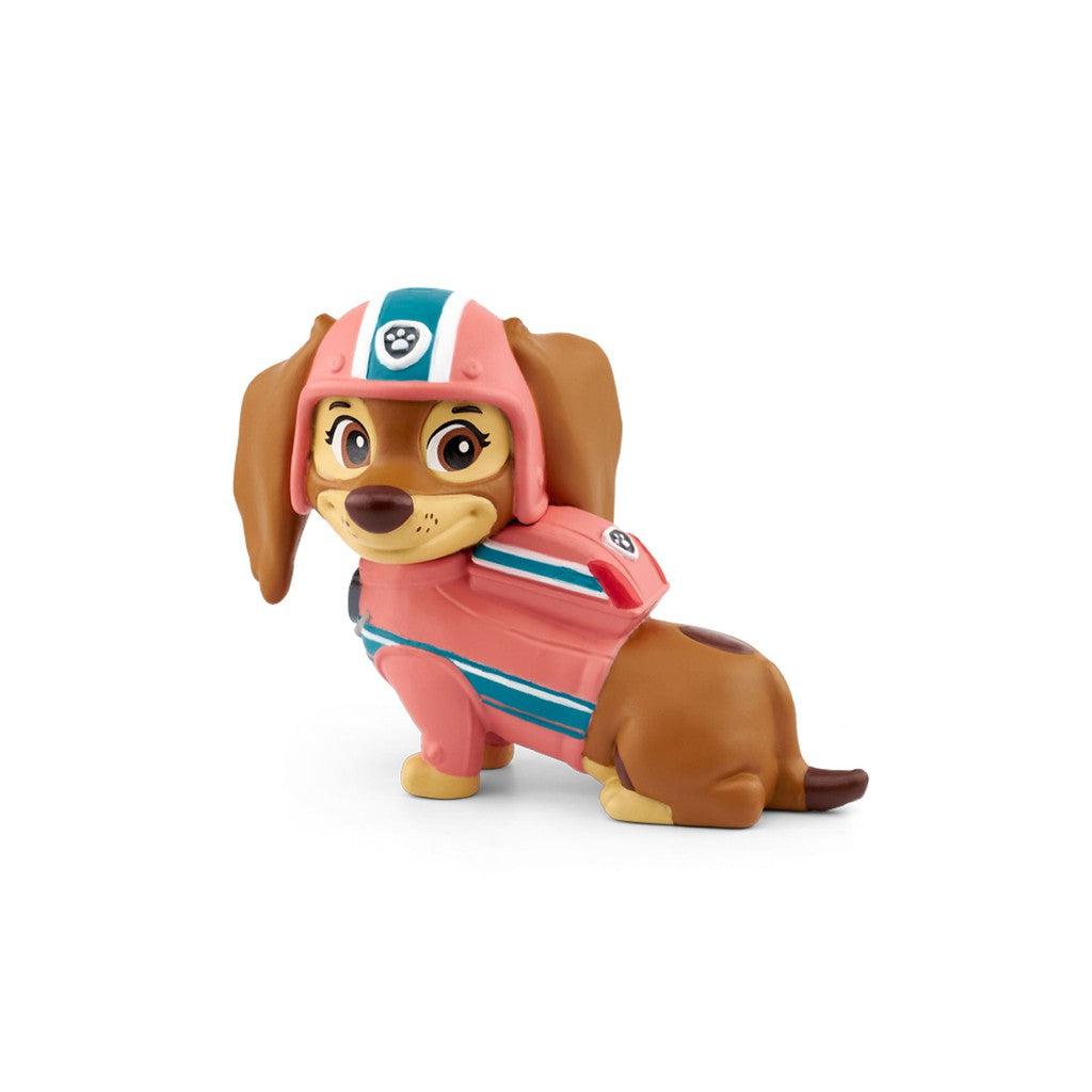 The tonie figure is a brown dachshund wearing a pink safety helmet, vest, and backpack