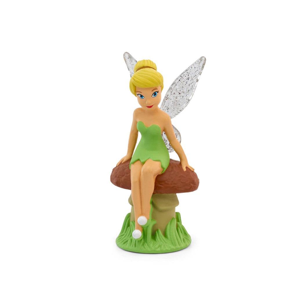 tonie figure is tinker bell, a fairy in a green dress and blond hair tied in a bun.