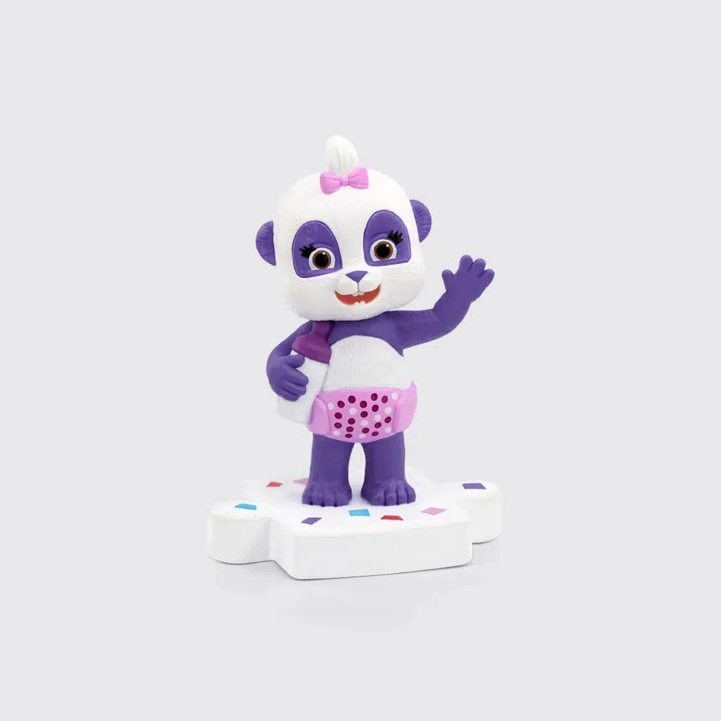 Tonie figure is a purple panda holding a bottle and wearing a pink diaper thats standing on top of a white puzzle piece platform with sprinkles on it