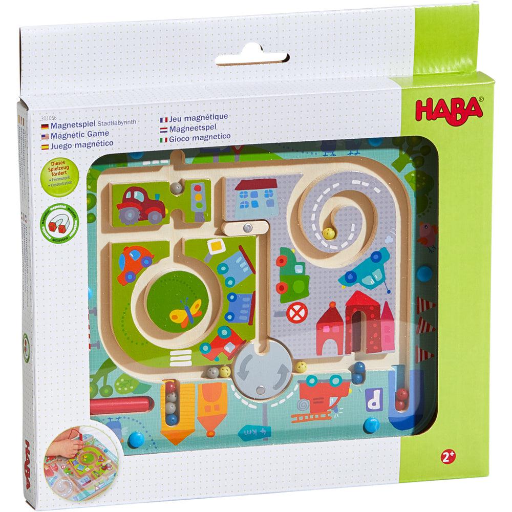 Image of the packaging for the Town Maze Magnetic Game. Part of the front is made from clear plastic so you can see the toy inside.