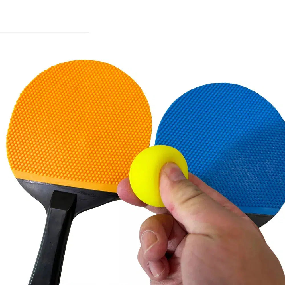 the paddles are rubber and the balls are spongy to bounce off the prampoline mat