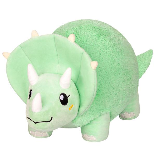 Green Squishable Triceratops dinosaur toy with a smiling face and white horns against a white background.