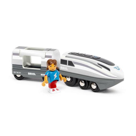 Image of the toy outside of the packaging. The train is a bullet train colored white and grey. The set comes with a little girl figure wearing a blue shirt, red pants, and brown hair.