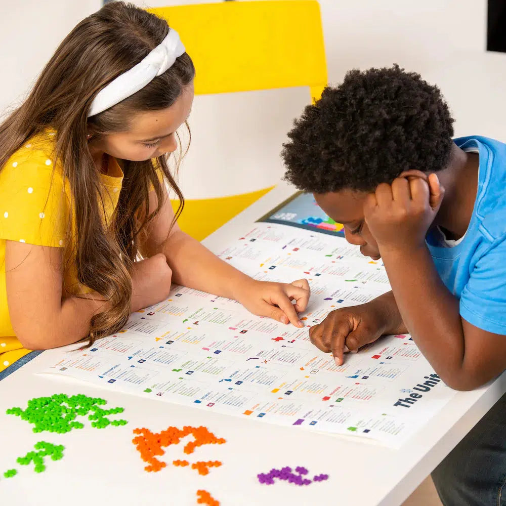 two children are learning about the states, while also working on the puzzle