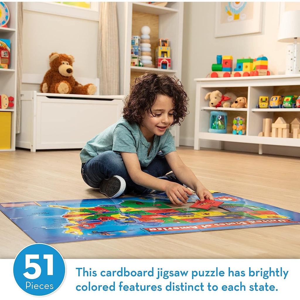 Scene of a child building the puzzle. Caption: This cardboard jigsaw puzzle has brightly colored features distinct to each state.