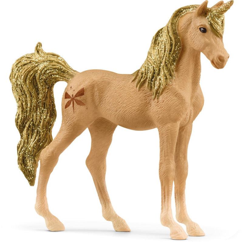 Image of the Unicorn Amber figurine. It is a honey colored unicorn with glittery golden hair. It has a brown dragonfly cutie mark.