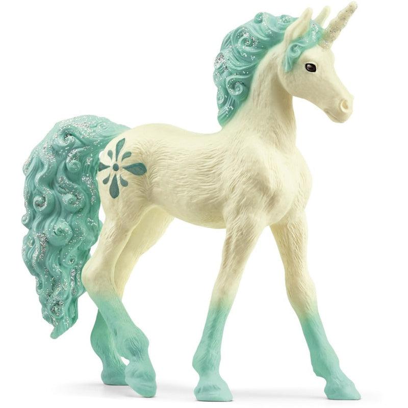 Image of the Unicorn Aquamarine figurine. It is a white horse with aqua curled glittery mane and tail. The hooves have an aqua fade up to the white body.