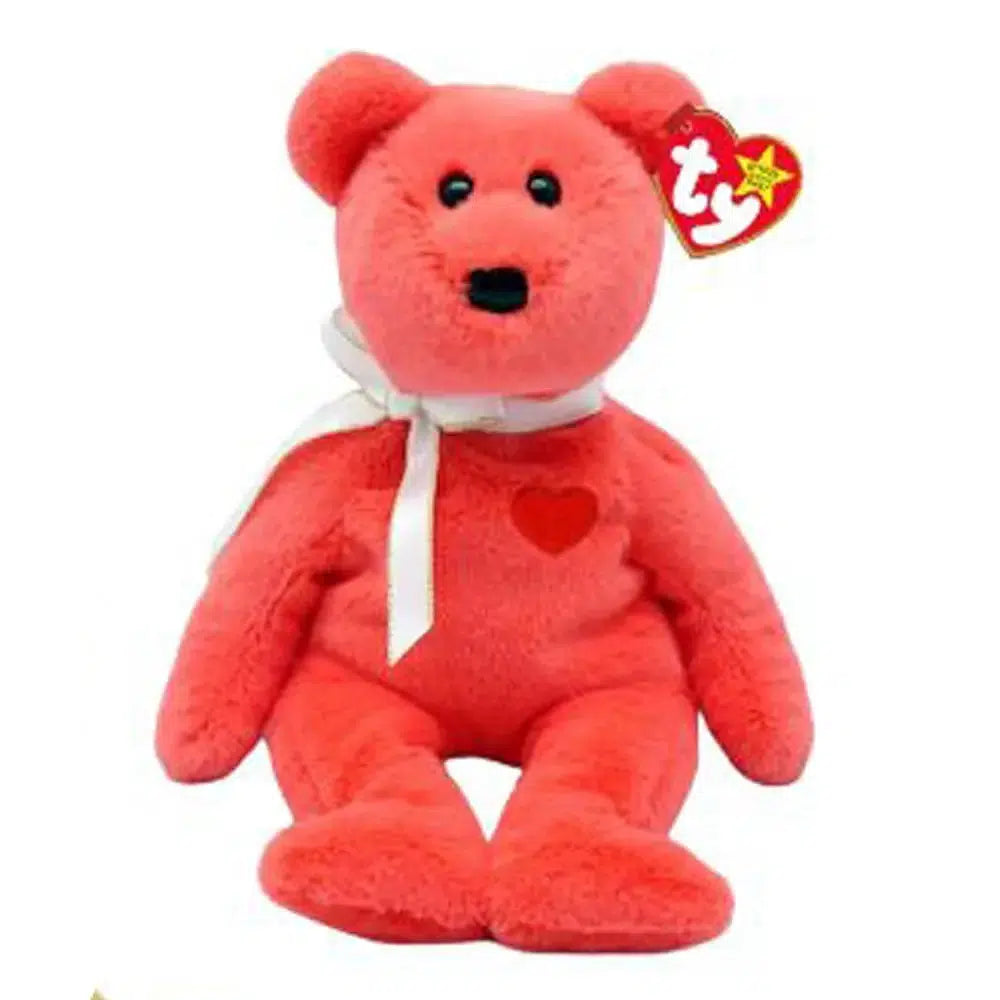 Valentino II is a soft red bear with black button eyes and a larger black nose. He wears a white ribbon tied around his neck and he has a red embroidered heart on his chest.