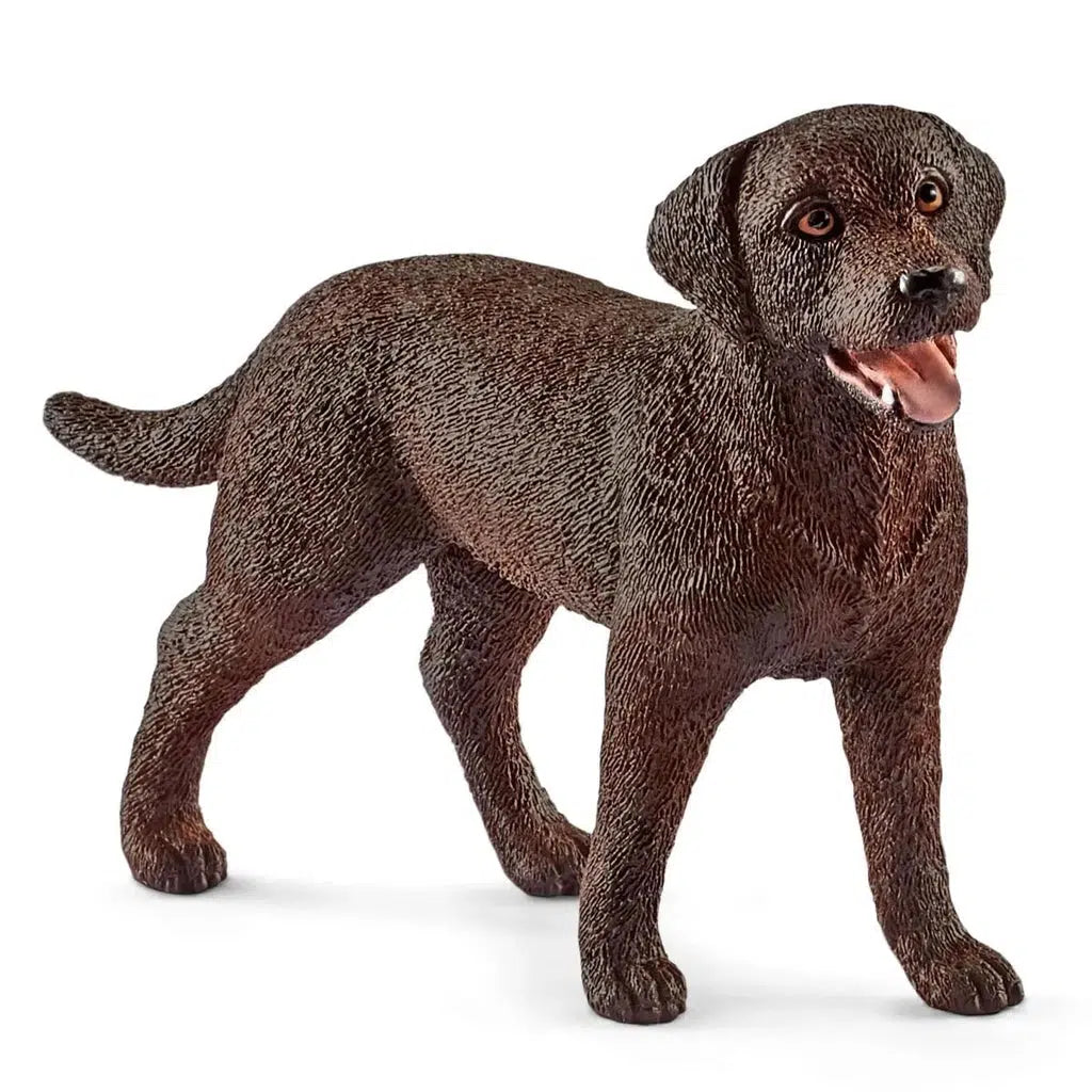 Close up of the dog figurine. It is a dark brown and it has its tongue sticking out.