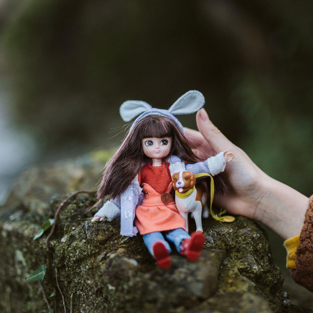 a spring themed doll with her puppy