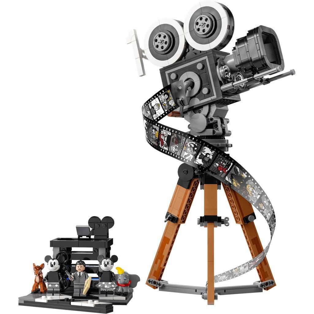 image shows the camera on a stand with film going down the leg, showing old black and white shots. there is also a small studio with a LEGO Walt Disney and a LEGO Mickey Mouse