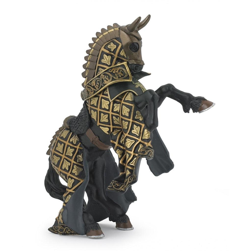 Image of the Weapon Master Bull Horse figurine. It is dark black horse with golden patterned cloth armor. It is dressed like a medieval horse.
