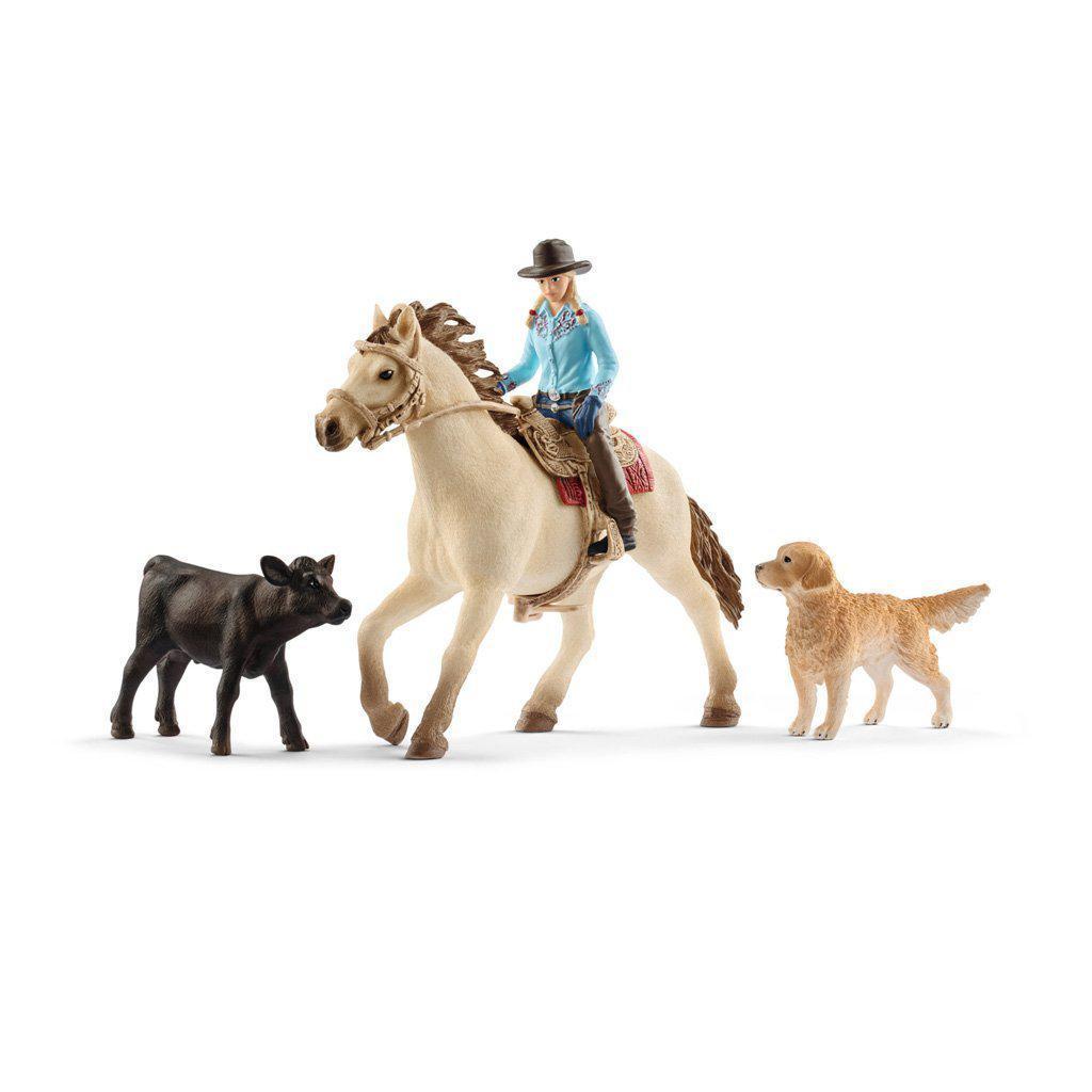 Image of the included play pieces. The set comes with a horse, a rider, a dog, and a cow. The rider is wearing a traditional riding outfit. The horse is tan with brown hair, the dog is a golden retriever, and the cow is black.