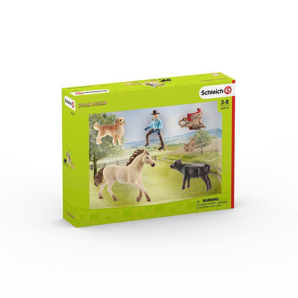 Image of the packaging for the Western Riding play set. On the front is a picture of all the included pieces in the set.