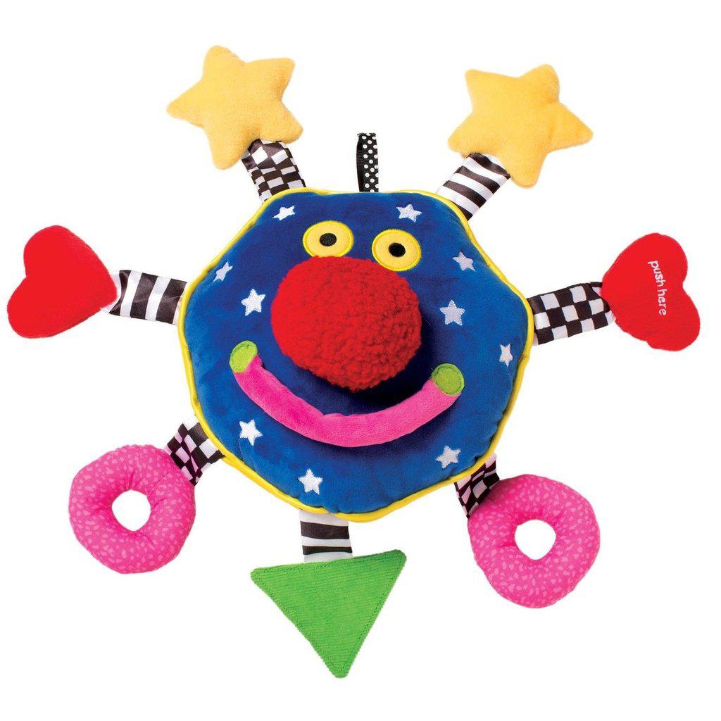 Image of the Whoozit baby toy. It is a Whoozit face (blue with a big red nose) with ribbons attached to the sides with different shapes on the ends. Two have yellow stars, two have red hearts, two have pink rings, and one has a green triangle.