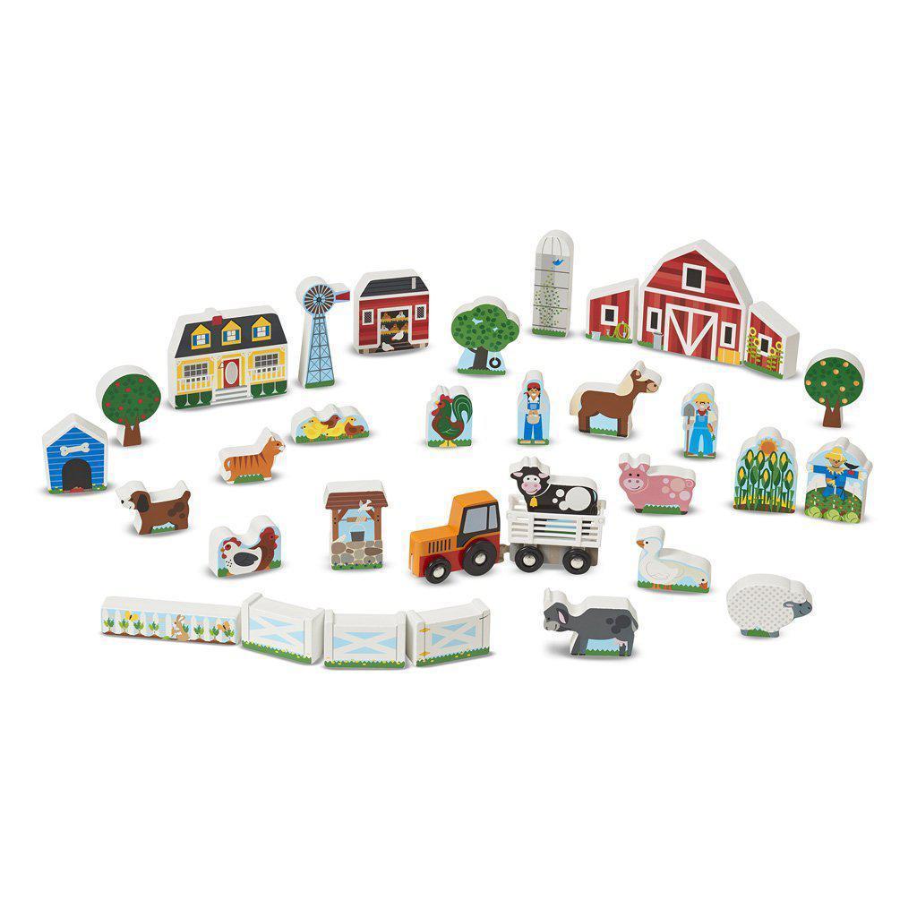 Image of all the figurines outside of the packaging. It comes with many different animals, buildings, and vehicles.
