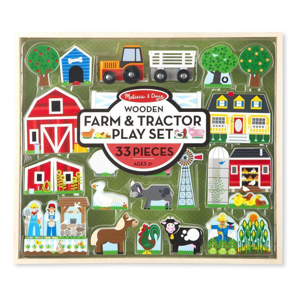 Image of the packaging for the Wooden Farm & Tractor Play Set. It has a clear plastic front so you can see the toys inside.
