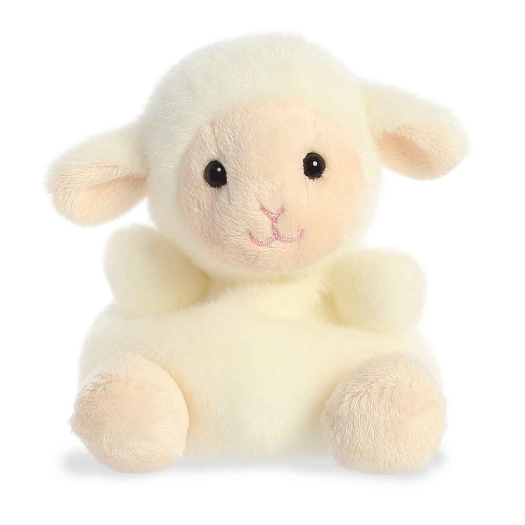 Image of the Woolly Lamb plush. It is yellowish white all over with her face, insides of her ears, and her feet a tan color. She has a pink nose and mouth in a smile.
