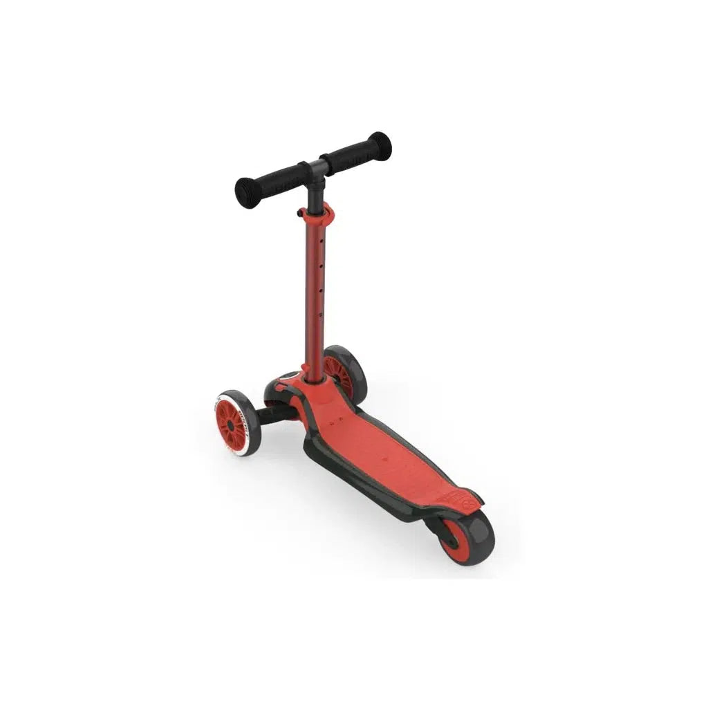 this image shows the YBike red scooter. it has threee wheels, two in front, one in back. There is a wide platform to stand on the scooter to roll on with. 