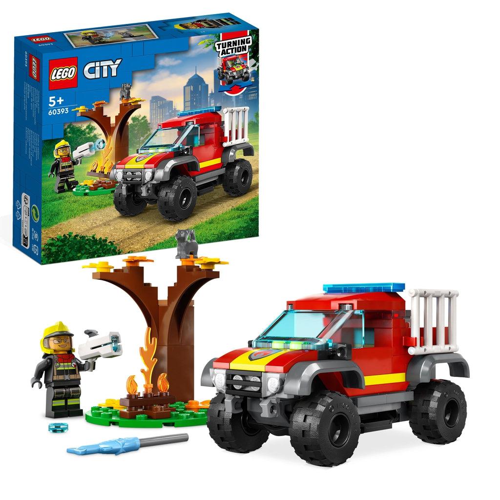 The lego set is shown in front of its box | there is a lego firetruck 4x4, a firefighter minifigure, a tree and fire, and a lego "water" shooter and ammo