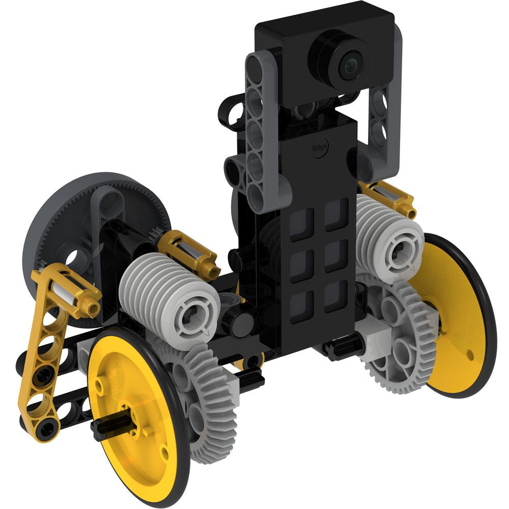 Drivable camera car model | Composed of yellow, black, and gray plastic pieces with two yellow wheels. | Camera is mounted on a small tower between the two wheels.
