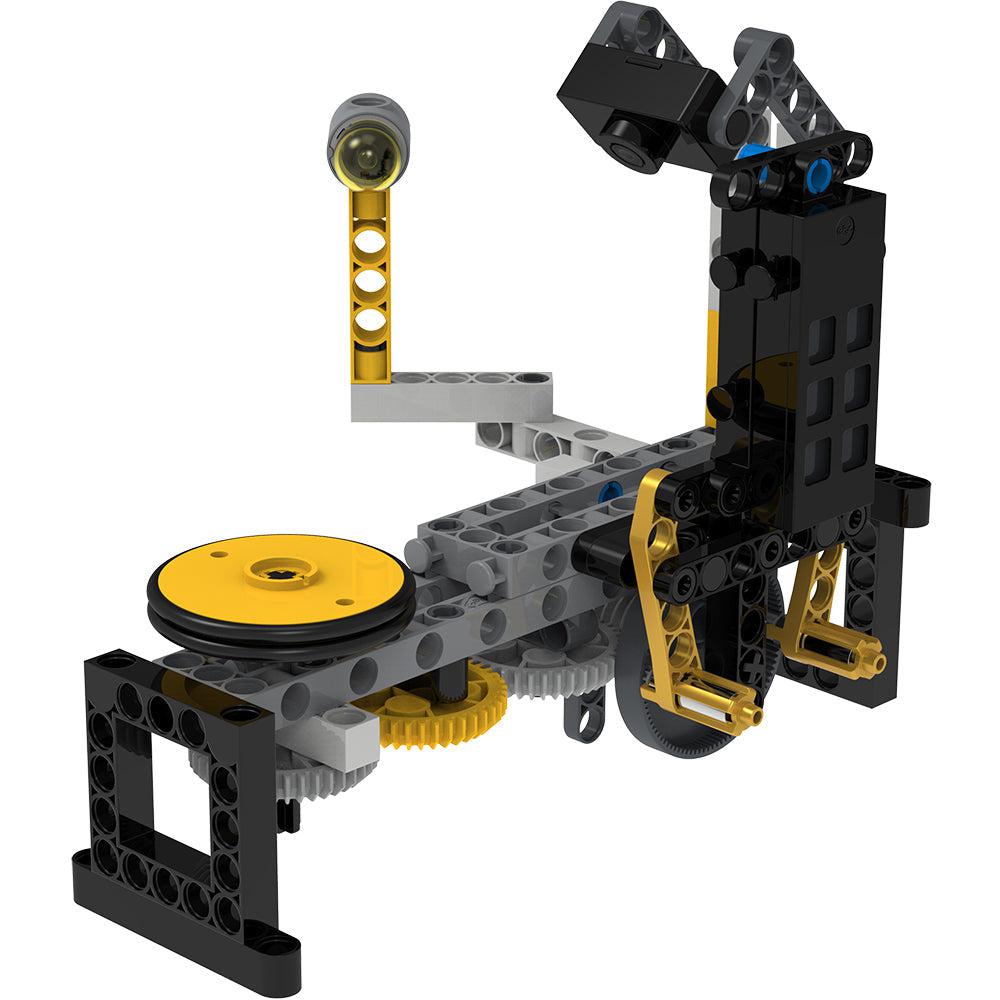 Turntable camera model | Model composed of black, gray, and yellow plastic pieces. | Pieces form a tower to which camera is mounted. Camera points down at yellow wheel turntable.