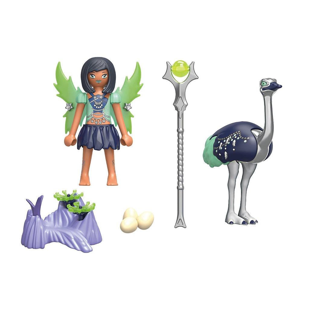 Image of the included pieces outside of the box. The set includes a moon fairy with green wings and black hair, a tall silver and green scepter, a navy blue, green, and silver ostrich, and an ostrich nest with three eggs.