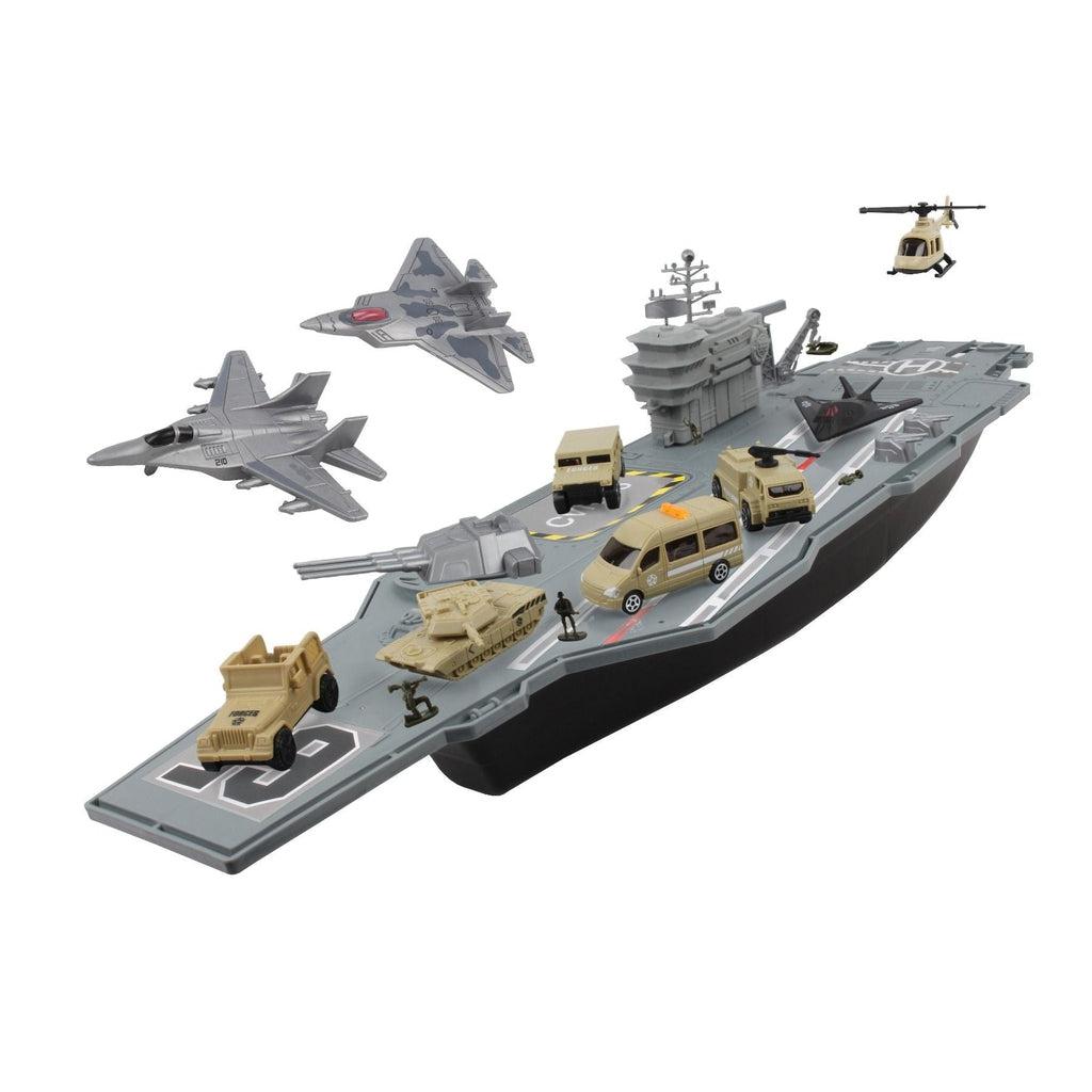 The aircraft carrier is displayed on a white background. the 4 vehicles are on deck along side of the tank and one of the 3 jets that is landed. 2 jets fly suspended above the carrier and the helicopter hovers behind the carrier.