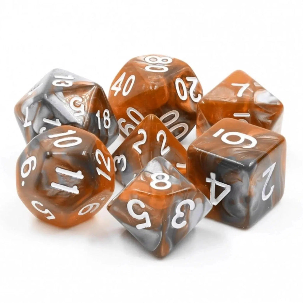 The 7 dice are shown arranged in a circle with the D4 in the center. Each dice is made with a swirled mix of grey and amber colored resin with white numbering.