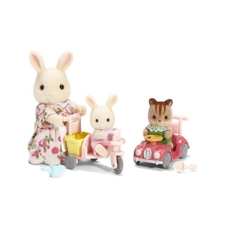 image shows 3 calico critters two children on a bike and car with handles that the mom critter can hold and push