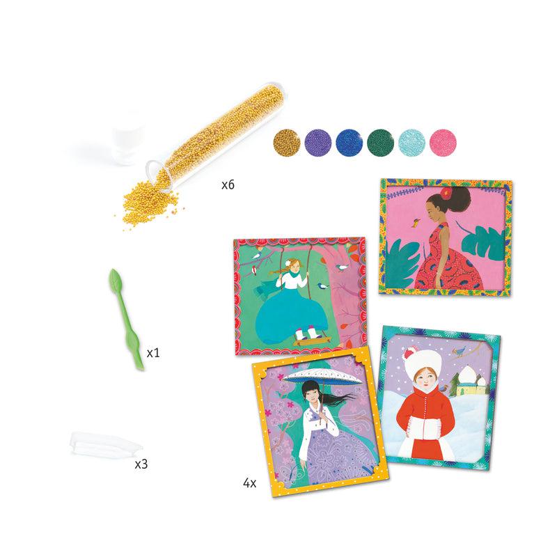 Image of the included parts in the kit. It includes 6 different colors of beads (gold, purple, blue, green, light blue, and pink), a tool, and four pictures.