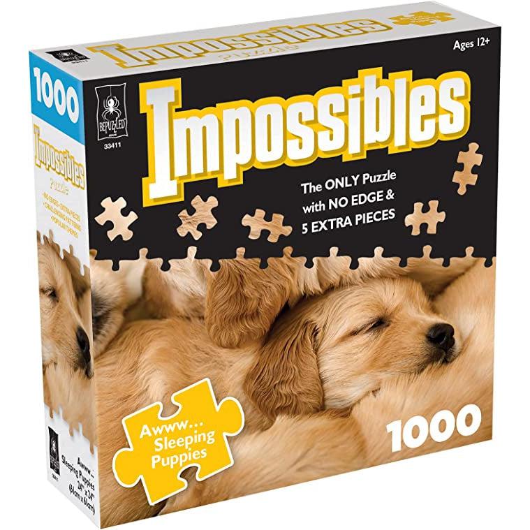 Impossibles Awww... Sleeping Puppies puzzle box | Image on front includes portion of puzzle image | Image: sleeping golden labrador puppies piled together 