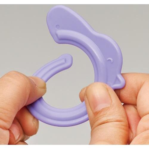 Shows that there is a break in each chick ring that allows another ring to be slid on. The rings are made from a bending durable plastic.