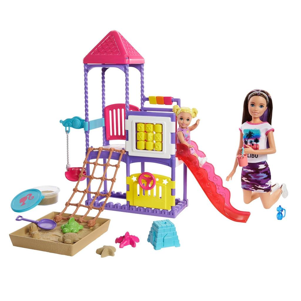 Shows the playground set out of the packaging and put together. The set has a pink slide, a climbing rope, a swing, a steering wheel, a sand pit, and some spinning blocks.