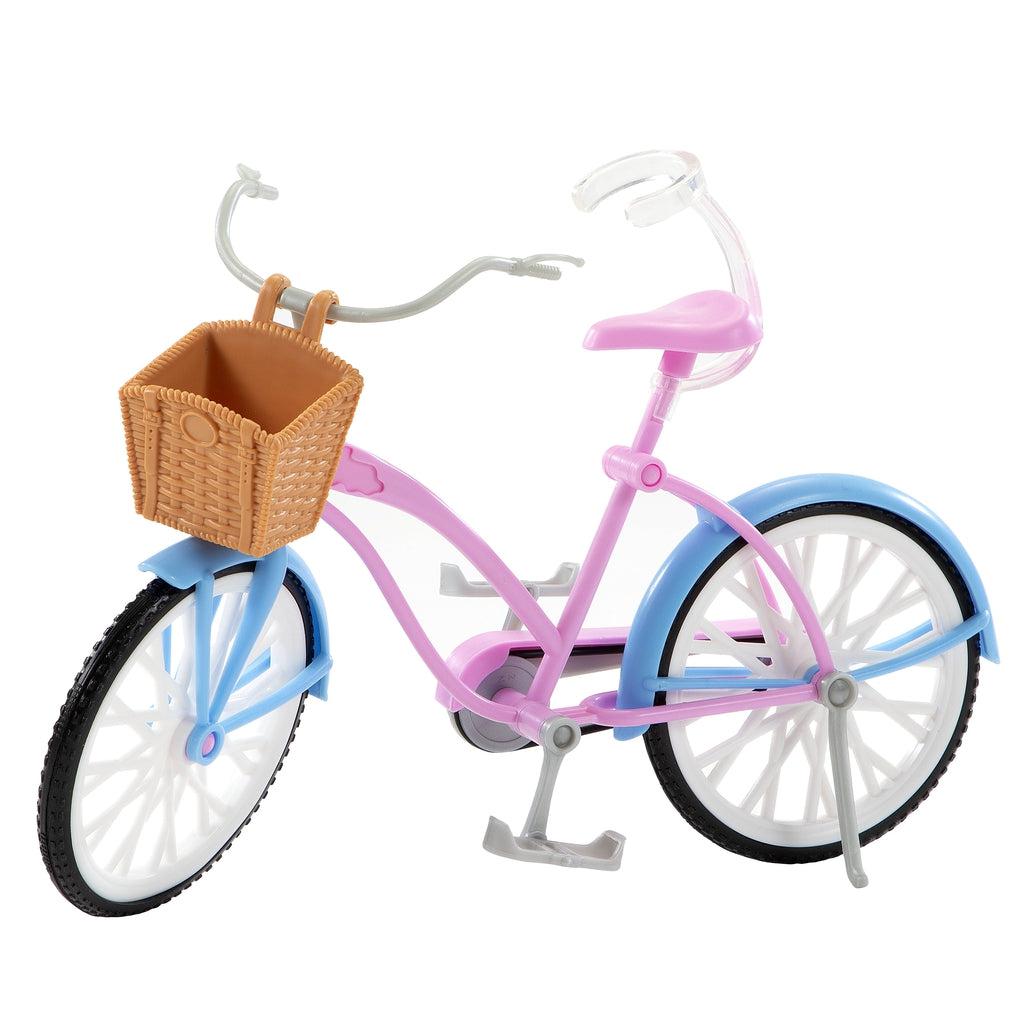 Up close view of the bicycle. It is pink and blue with a basket in the front. The seat has a clear clamp so that Barbie can stay on the bike by herself.