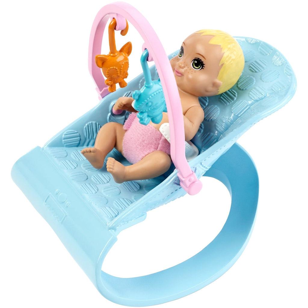 Shows that the baby dolls fit into the rocker.